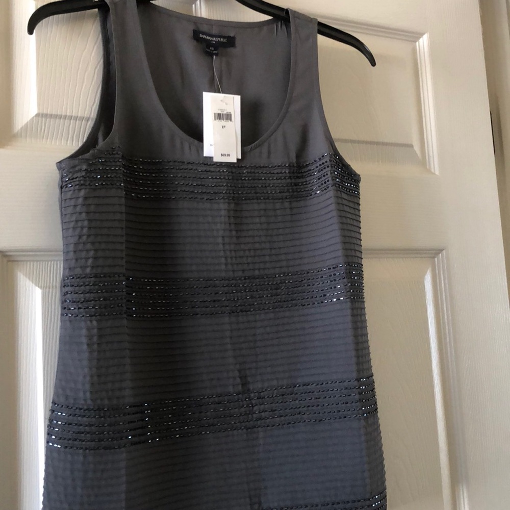Very pretty top with sequins and tucks